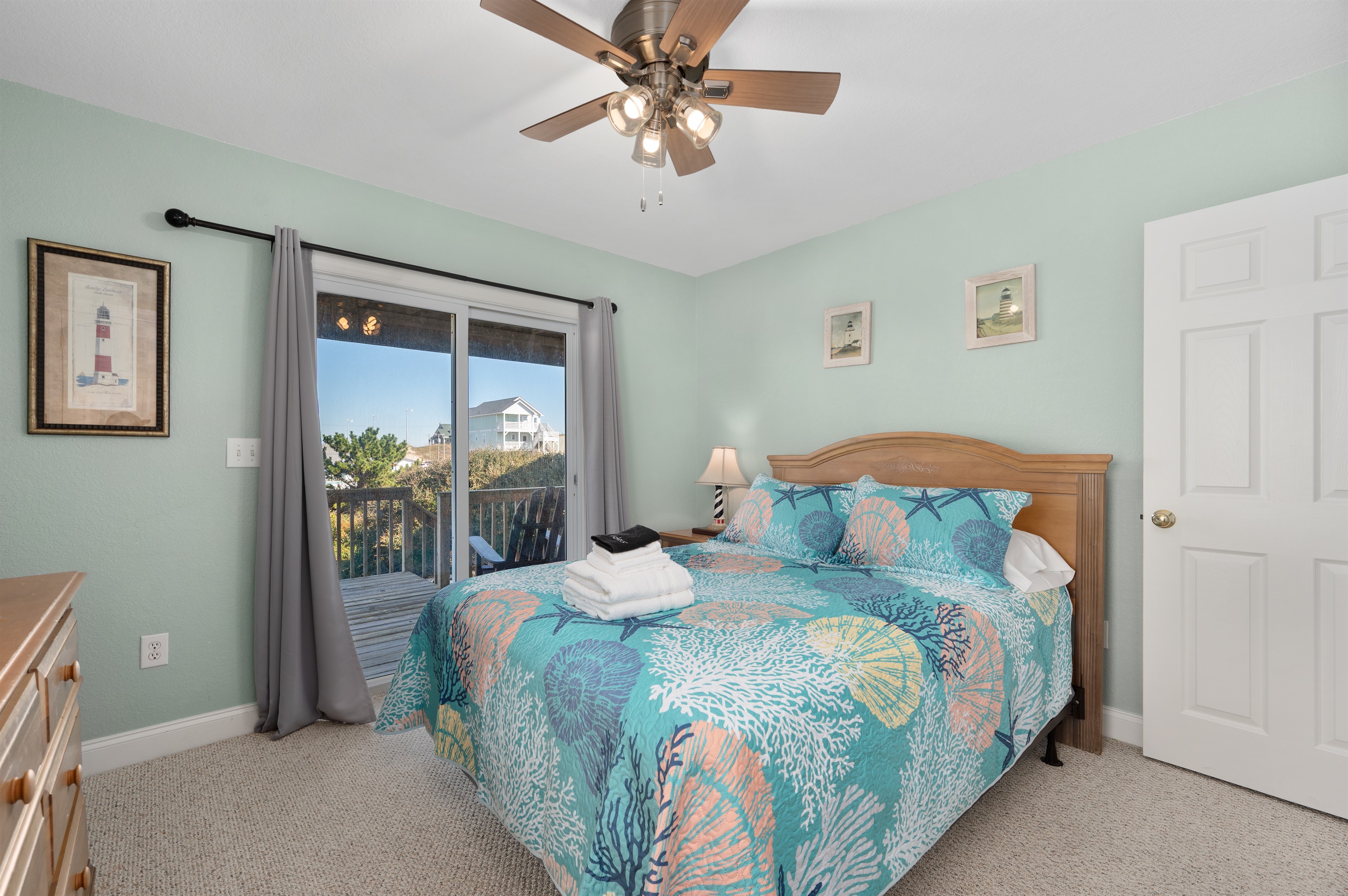 Cozy Queen bedroom with Smart TV and sliding door to deck.