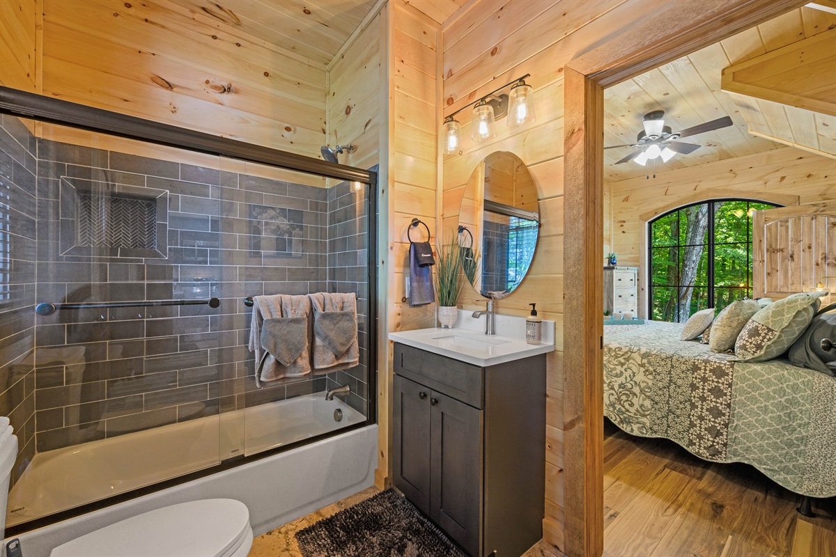 Juniper Cottage Full bathroom with shower and tub by master bedroom on main floor