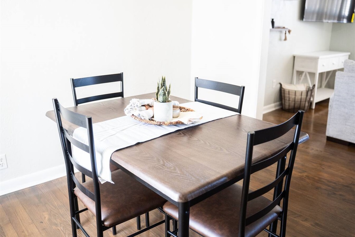 Spacious dining area with seating for four—perfect for meals or game nights.
