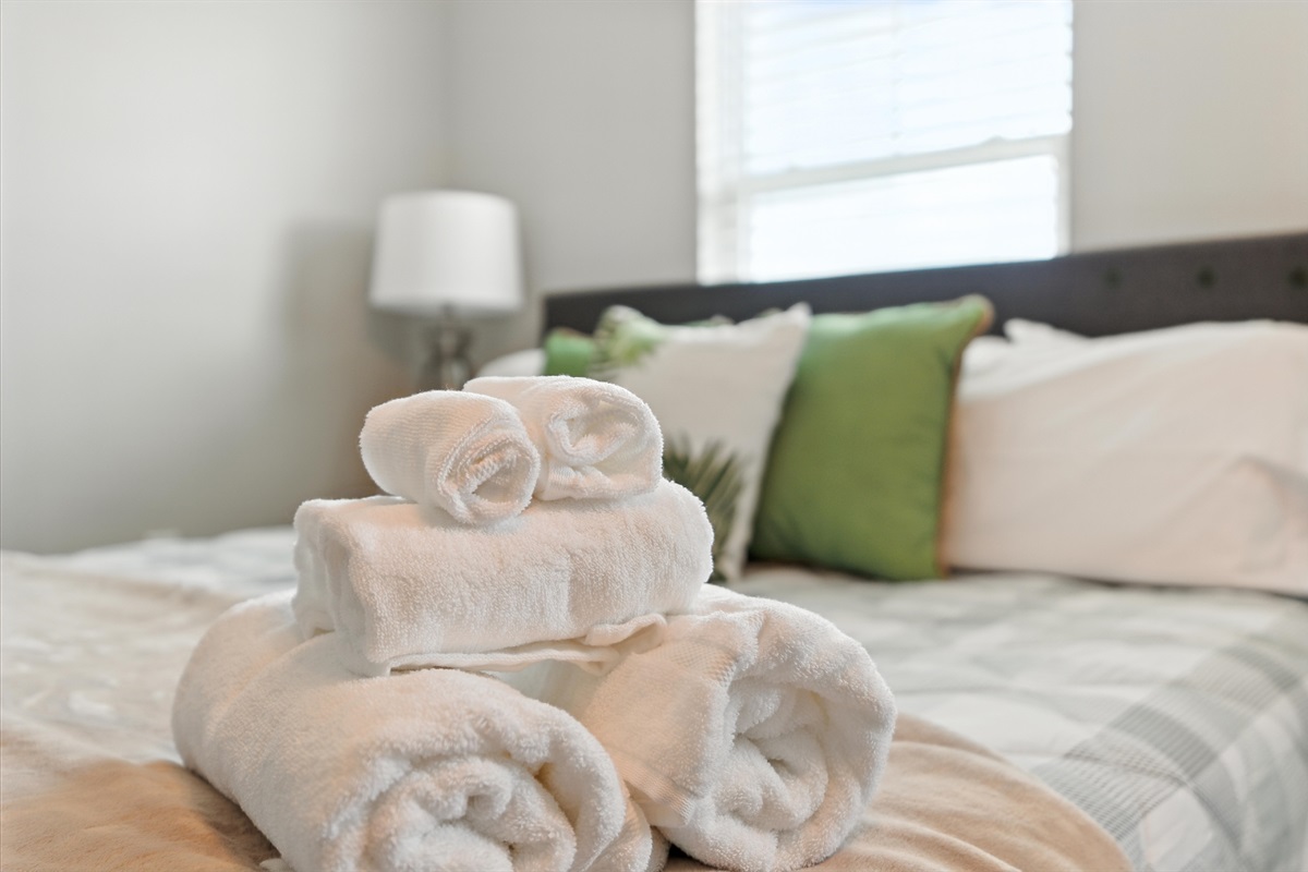 Fresh linens and towels await in your private bedroom