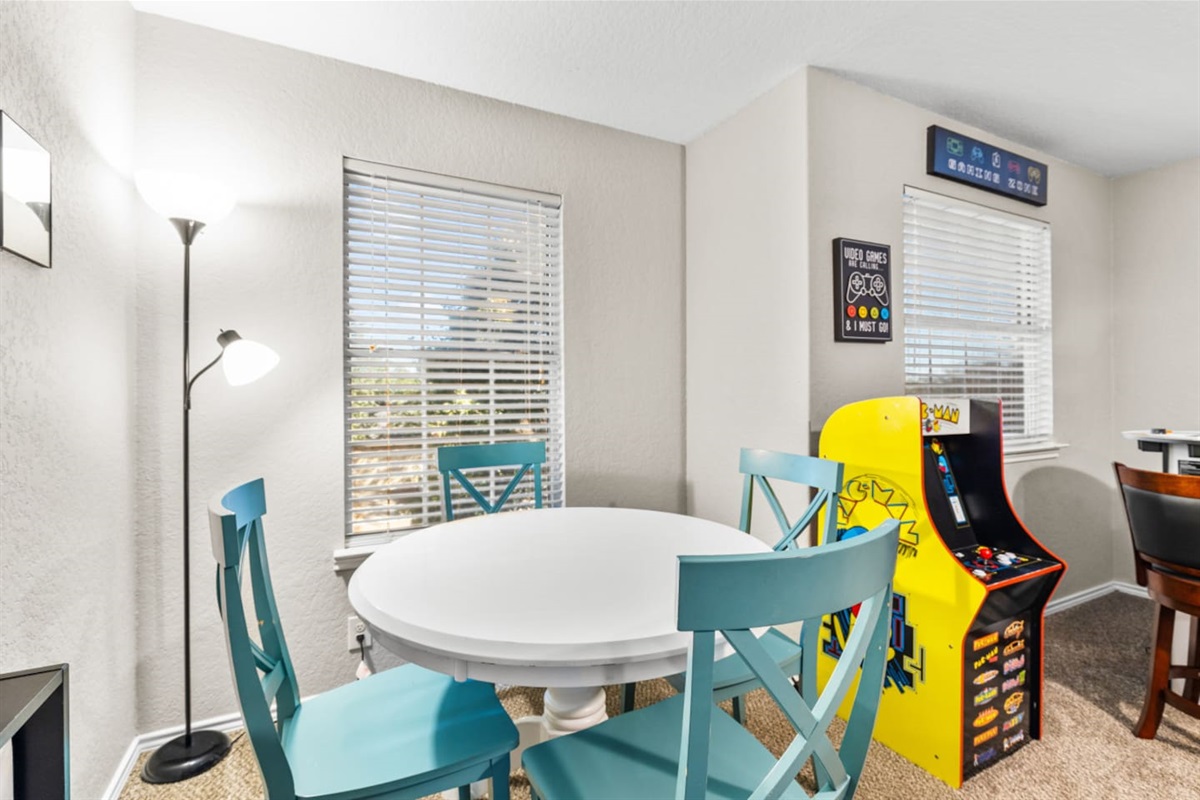 Cozy sitting nook in the game and cinema room with seating for 4, perfect for card games, board games, and late-night hangouts.