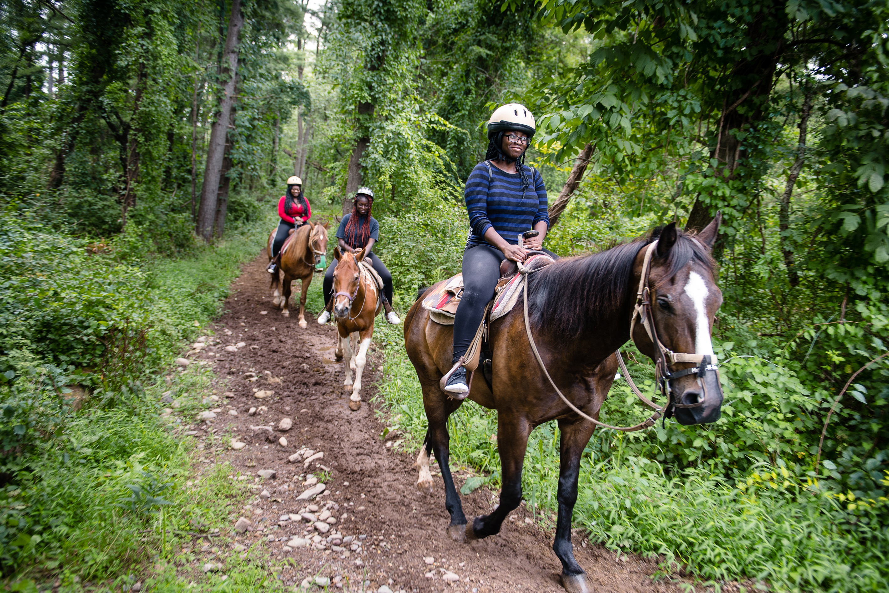 Take trail ride on horseback