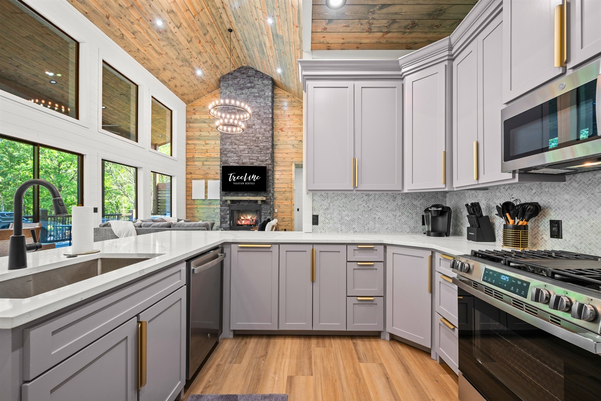 Stainless steel appliances and clean modern design give the kitchen a polished yet comfortable feel.
