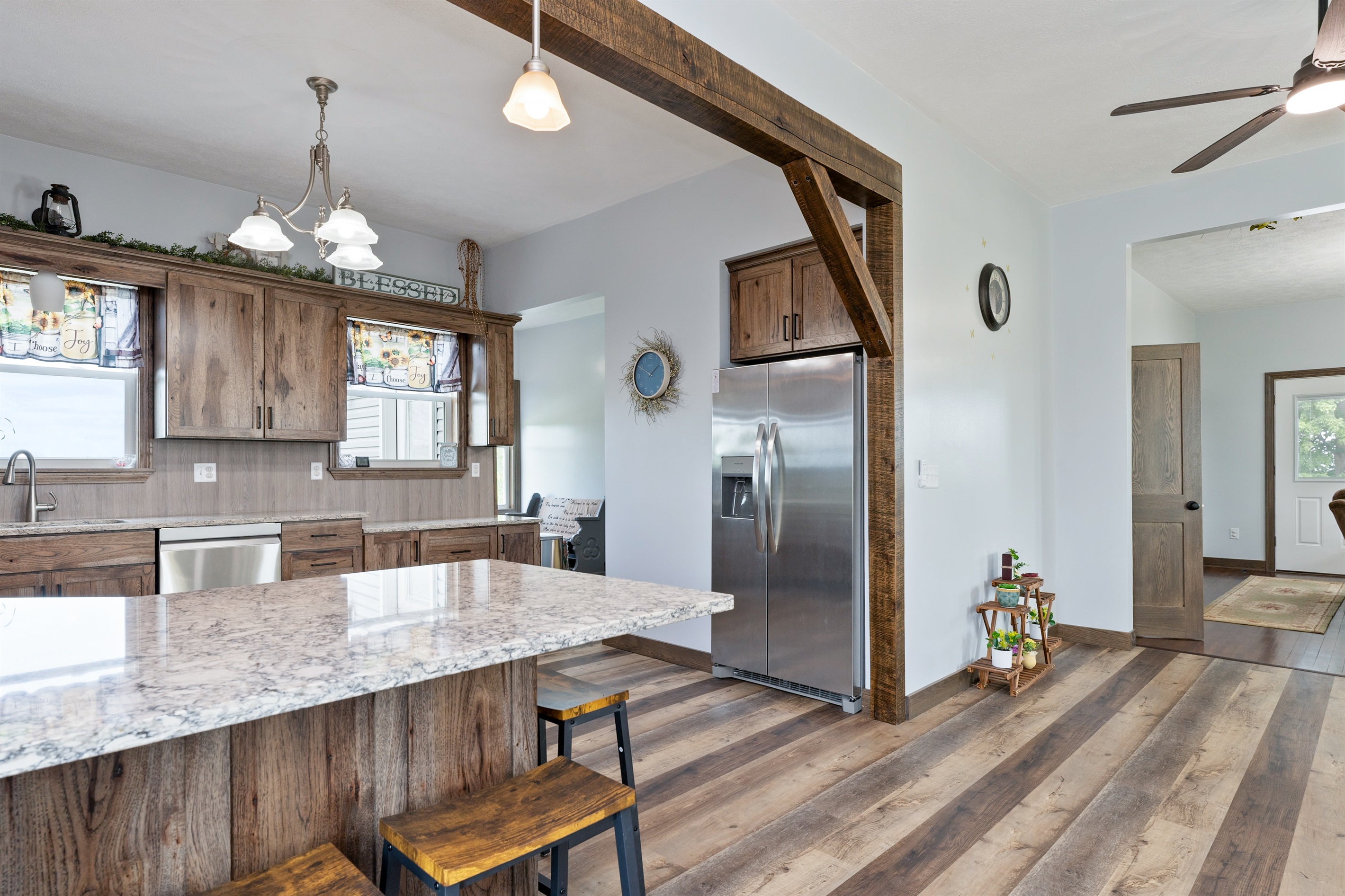 Expansive kitchen featuring stainless steel appliances, ample cabinet space, and plenty of natural light for a welcoming cooking experience.