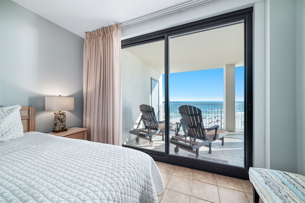 Step out onto your private balcony and enjoy the fresh sea air. This primary bedroom features a comfortable KING bed and a flat-screen TV for your enjoyment.