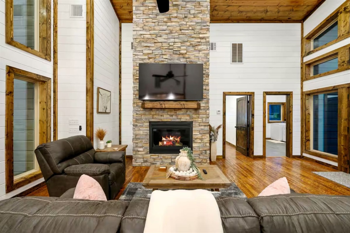 Soft lighting, plush seating, and warm wood tones—your perfect cabin moment.