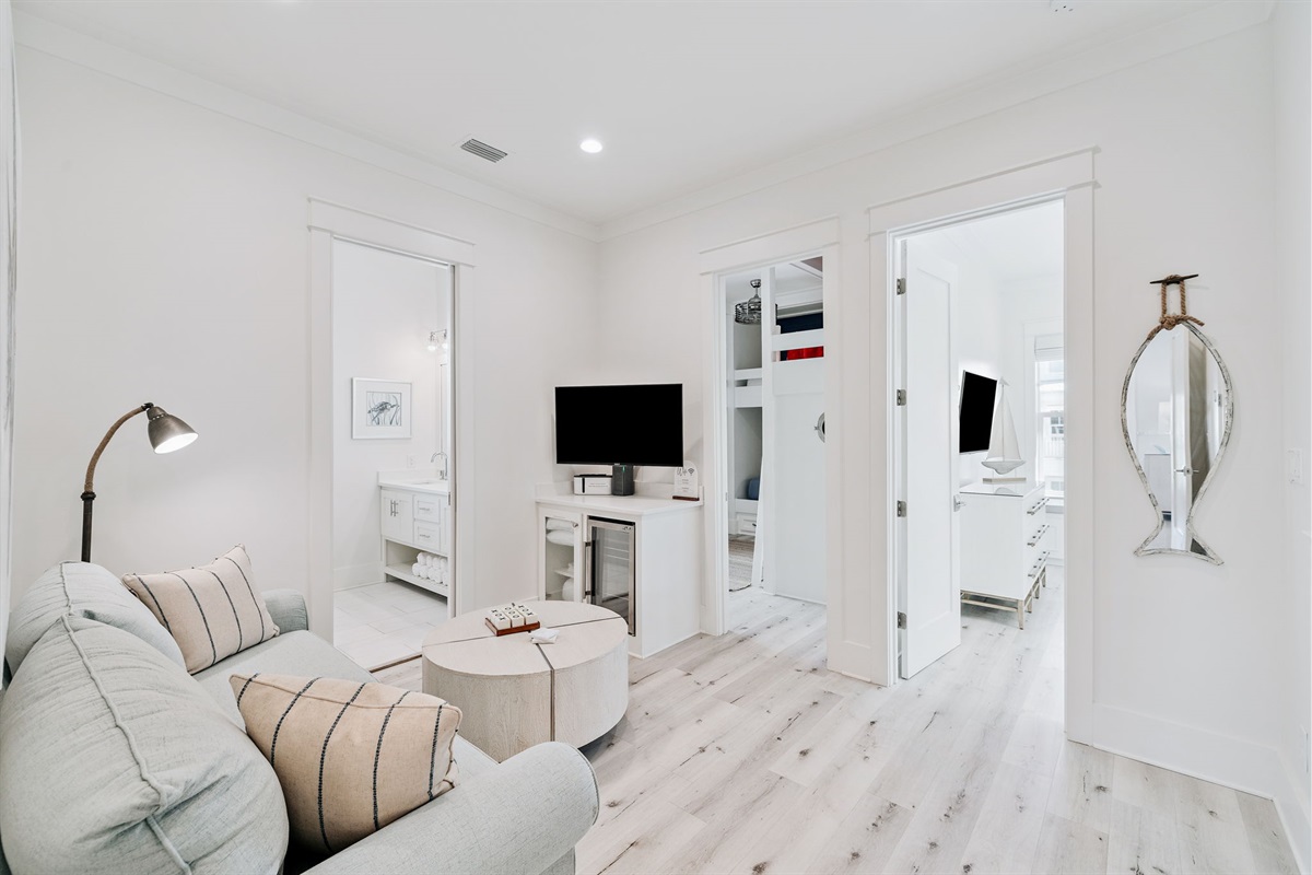 Second floor common area with a queen bed pull-out sleeper sofa, smart-TV with USB hookups, and a mini fridge. Perfect hangout spot- bring your own gaming console to connect to the TV and play