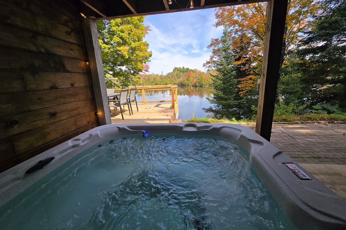 - unwind in the private hot tub with lake scenery   - covered patio offers shade and year-round comfort   - soak and enjoy peaceful views in total relaxation
