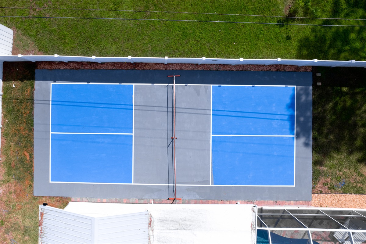 From sunrise rallies to sunset matches, this aerial shot captures the centerpiece of your stay—the inviting pickleball court that guests love.