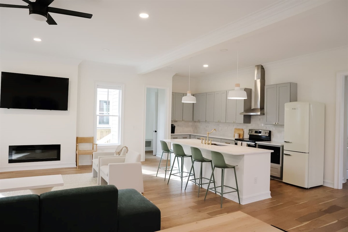 Lots of counter and cabinet space make for easy entertaining. The kitchen comes complete with stovetop, oven, microwave, fridge, freezer, and Keurig coffee maker. 