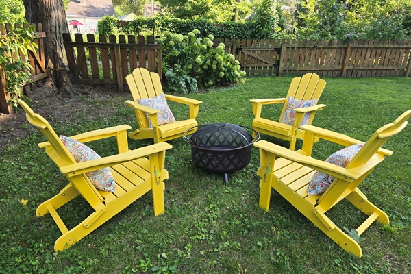 Gather, unwind, repeat—our signature yellow Adirondak chairs and firepit await.