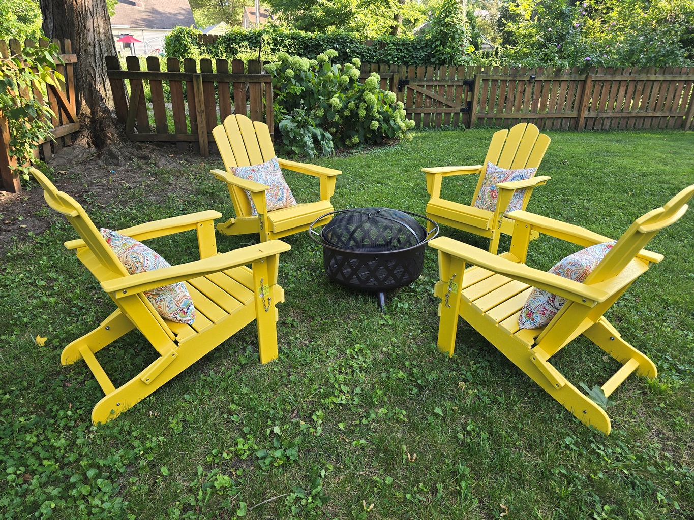 Gather, unwind, repeat—our signature yellow Adirondak chairs and firepit await.