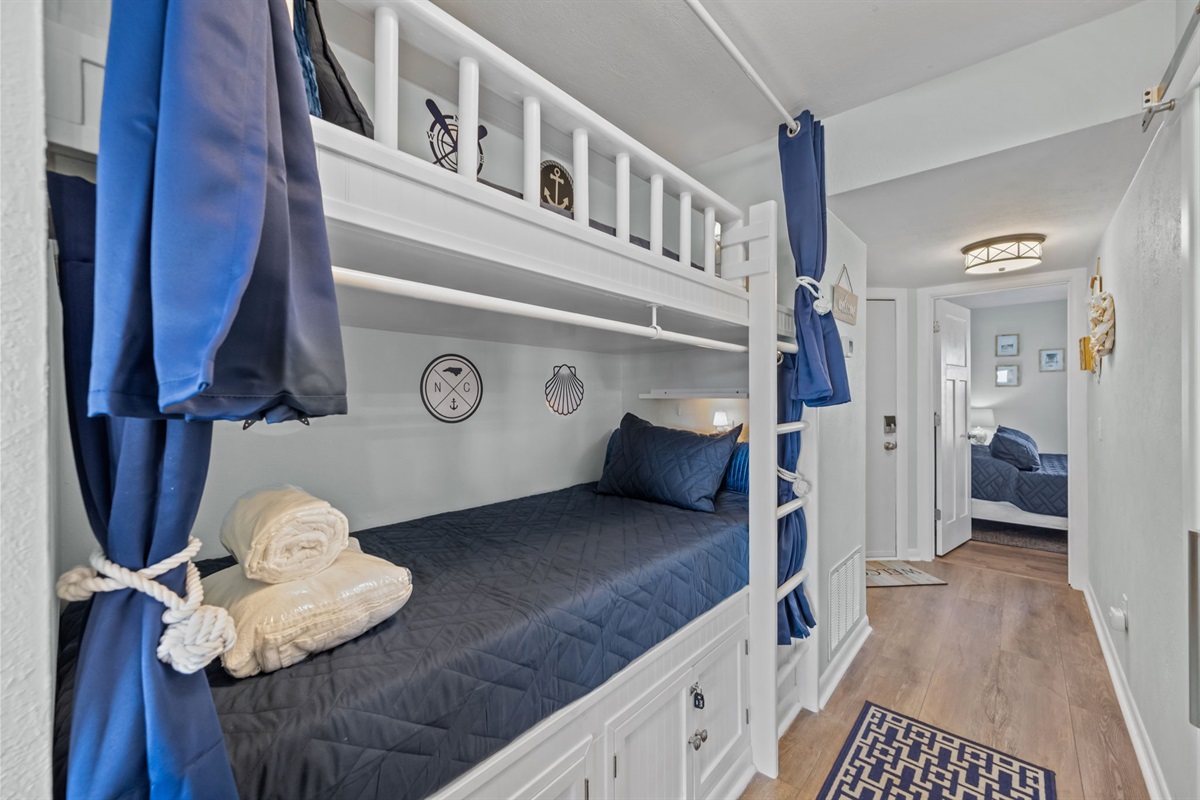 Built-in twin bunk beds tucked into the hallway, perfect for kids or extra guests