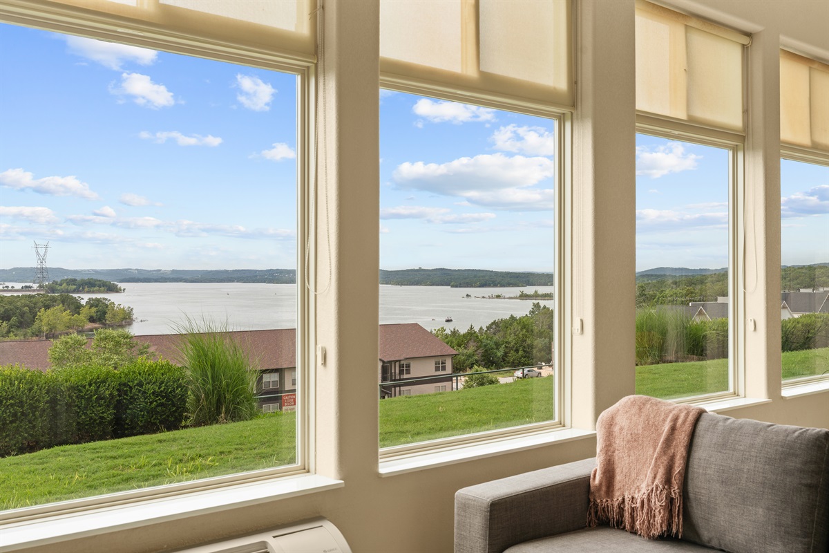 A wall of windows keeps the sunroom bright and the scenery front and center.
