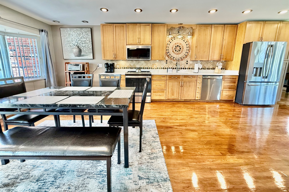 With the kitchen, dining, and living areas all connected, this space makes it easy to cook, dine, and relax—all while staying connected with your group.