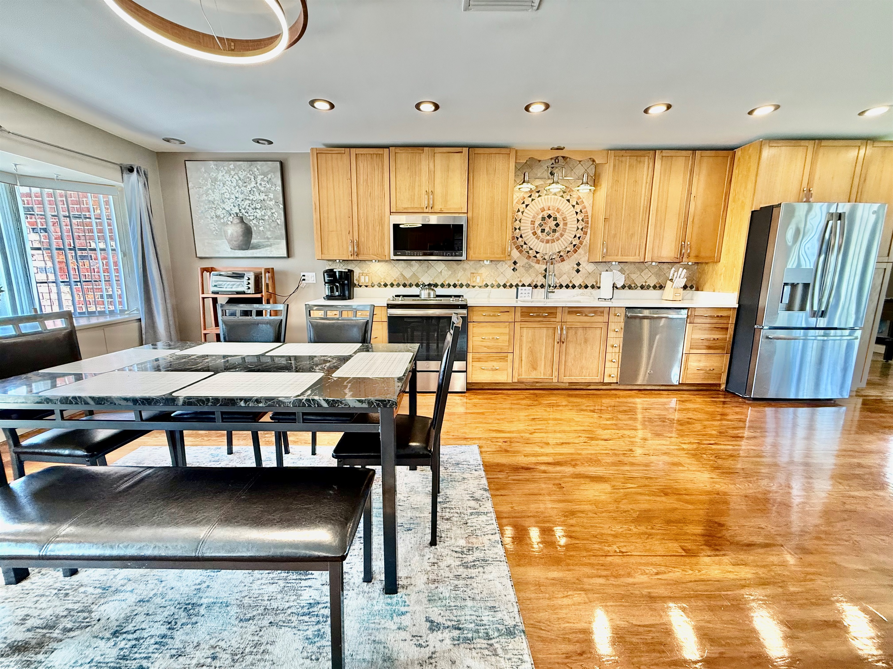 With the kitchen, dining, and living areas all connected, this space makes it easy to cook, dine, and relax—all while staying connected with your group.