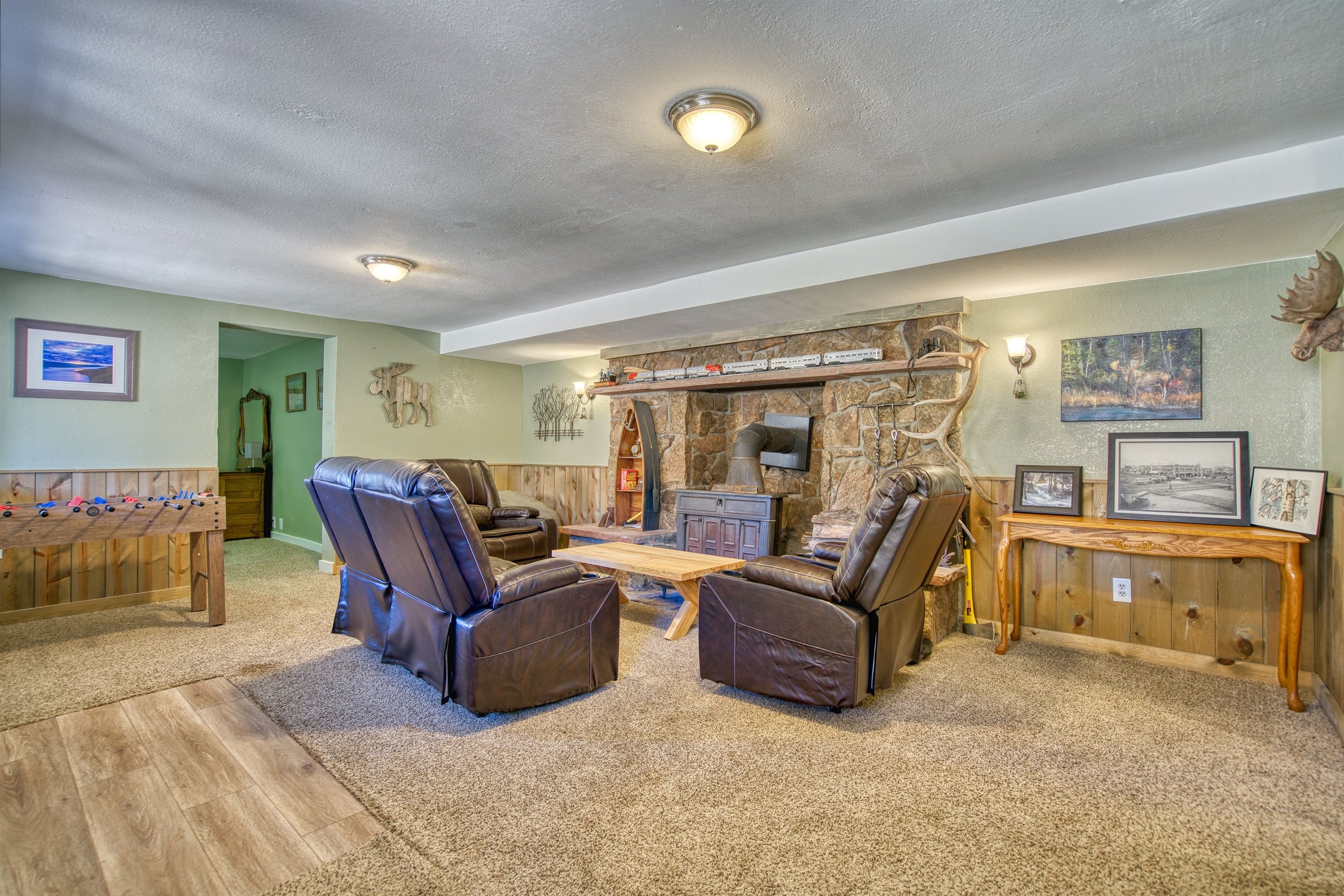 Lower Living Room with Woodburning Fireplace and Foosball
