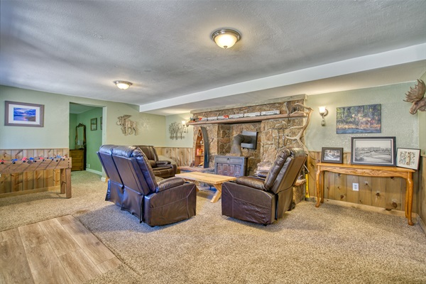 Lower Living Room with Woodburning Fireplace and Foosball
