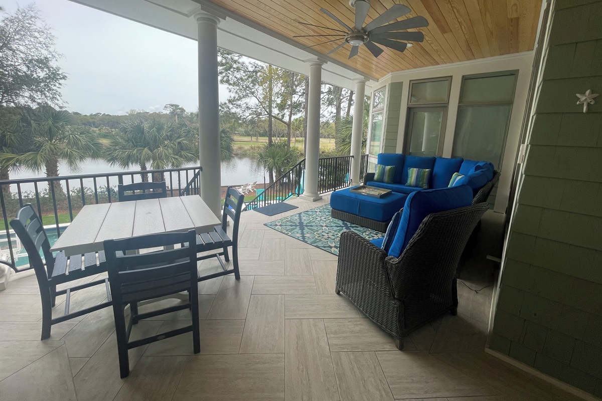 Rear porch with views of pool, lagoon and golf course.  Perfect for relaxing.