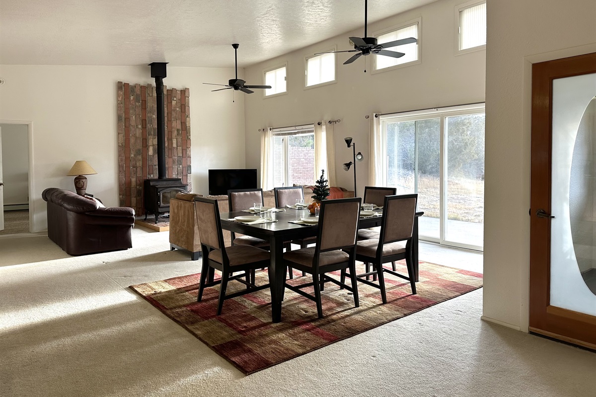 The great room has a west-facing view with plenty of evening natural light (and gorgeous sunsets). Room for everyone in your group! 