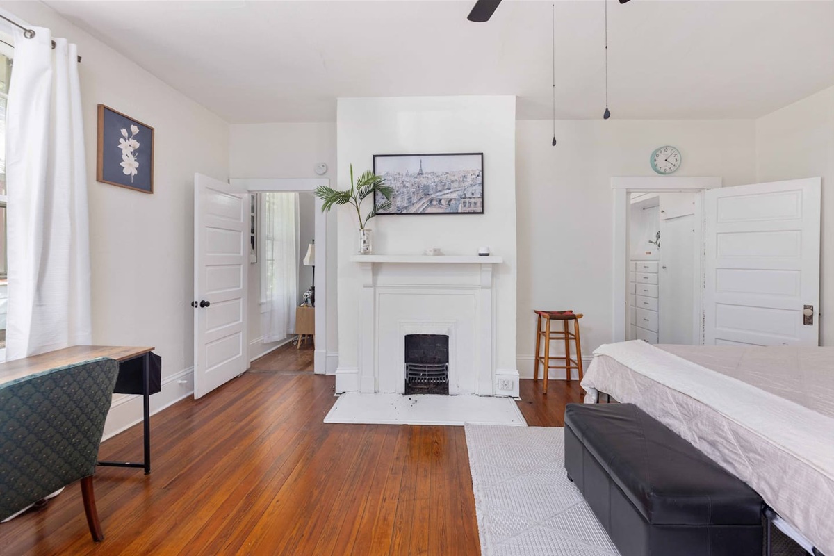 Master bedroom with entrance to living room and hallway to bathroom. 