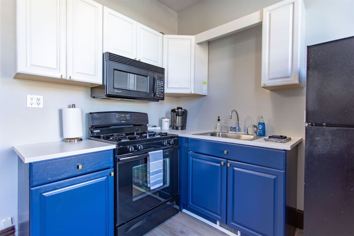 Fully equipped kitchen with a fridge, stove, oven, microwave, and all essential kitchenware, making it easy to prepare and enjoy meals during your stay.