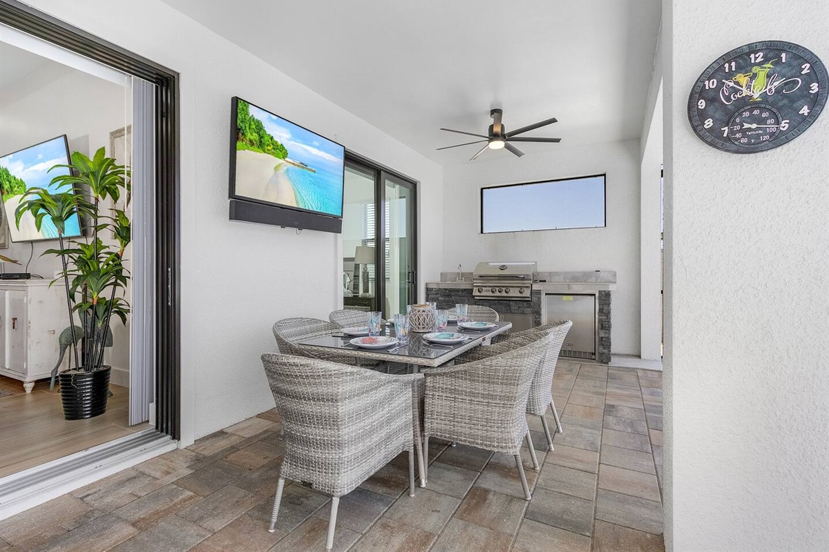 Enjoy outdoor dining while watching your favorite shows on the outdoor TV, all set against spectacular pool and water views!