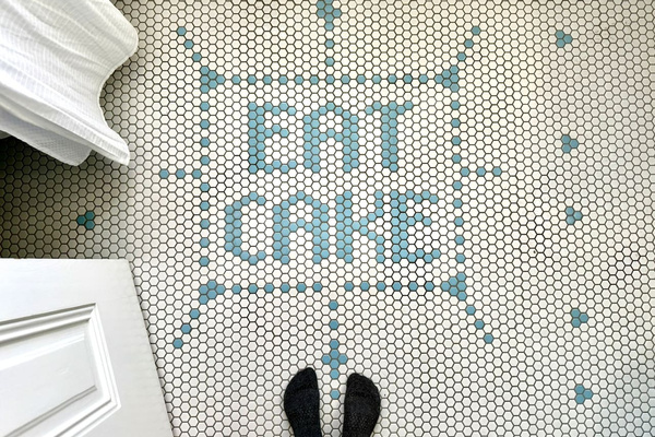 Custom hex-tile floor offers one simple instruction for your stay in Los Alamos: ENJOY!! Character-filled surprises like this are tucked throughout Heritage House.