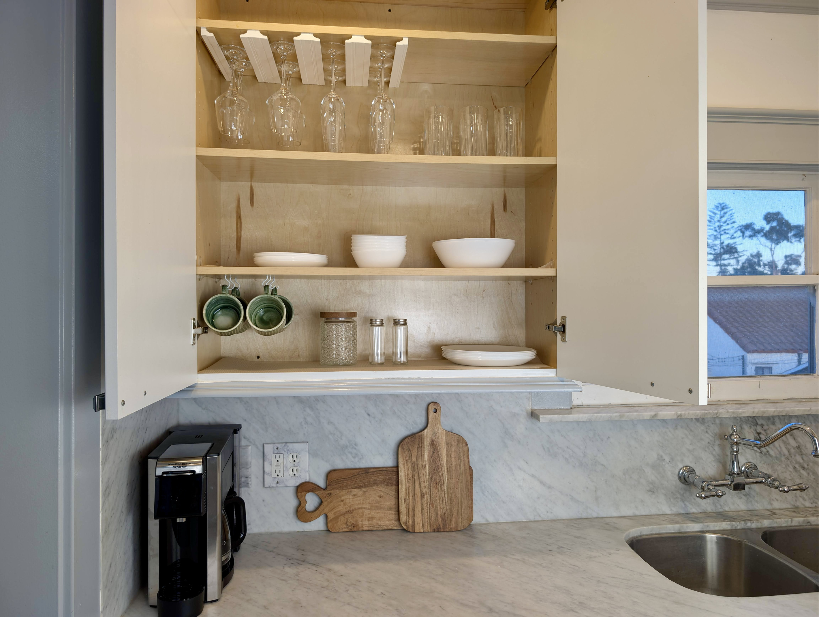 Cook and dine with ease. The kitchen is fully stocked with dishes, glassware, mugs, and essentials, everything you need to feel at home.