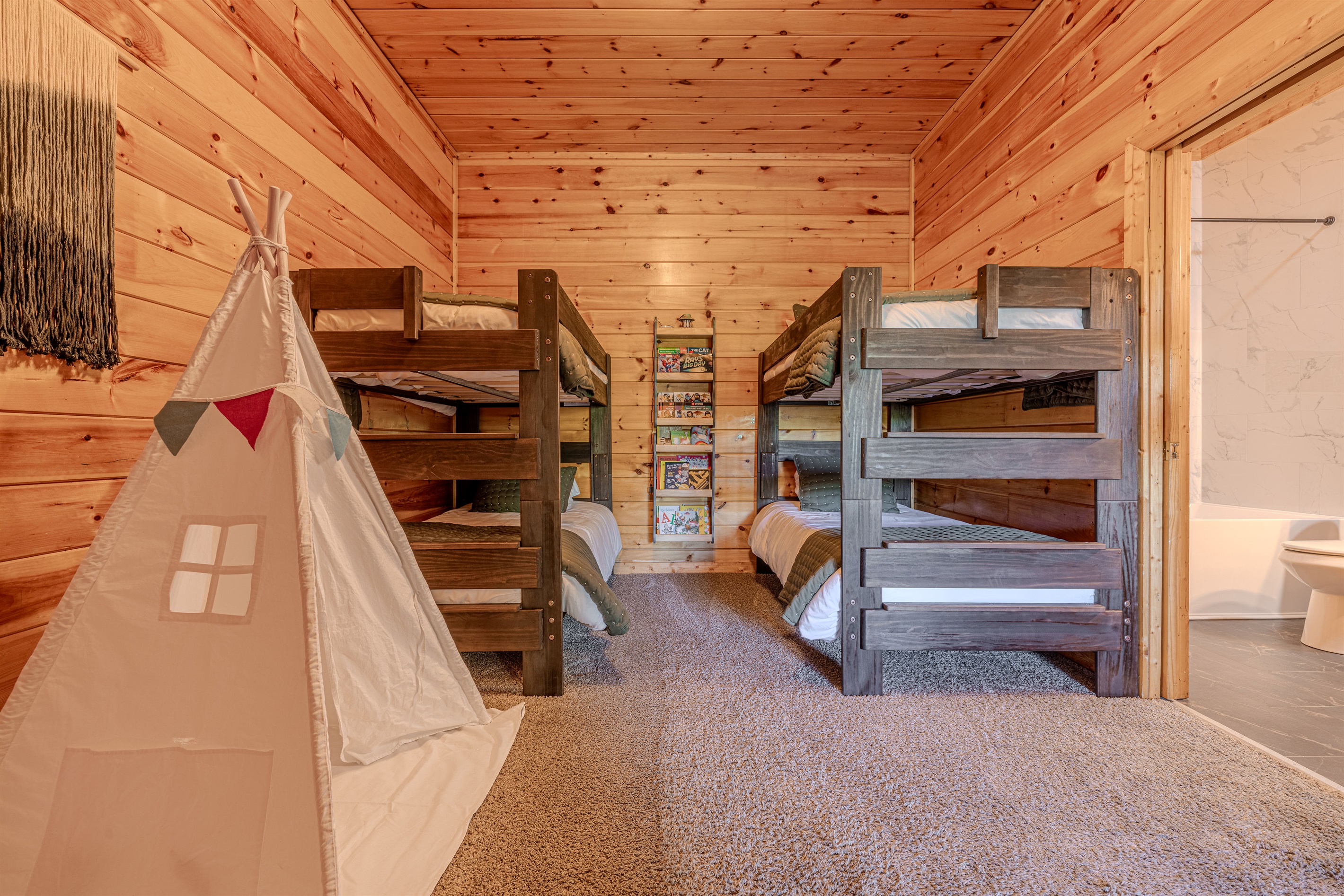 Spacious twin bunk room with lots of space and books so the kids have a space of their own!