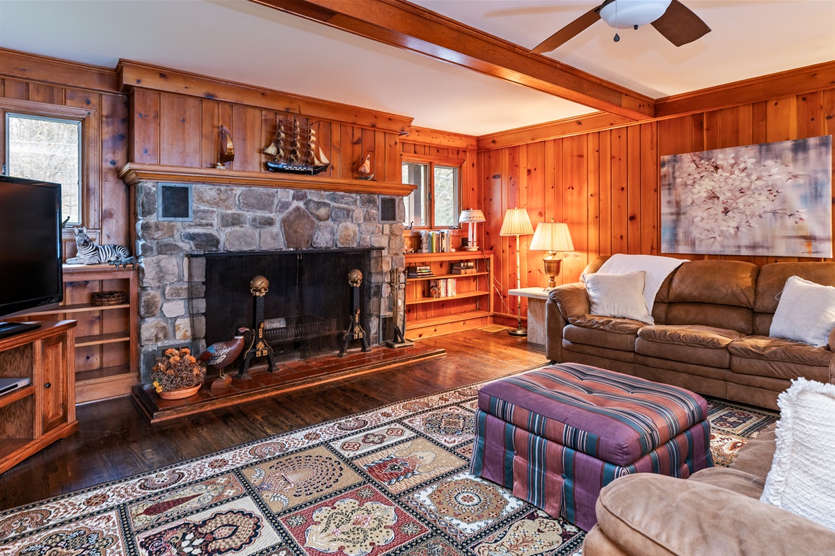 Relax and unwind in the open living room with wood fireplace(not usable by guests)main house