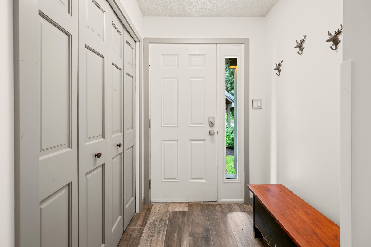 Private entry foyer with a closet for coats, boots and ski gear.