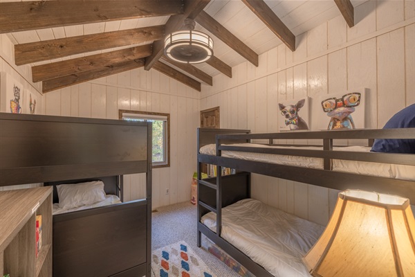 Upstairs bedroom with dual twin-over-twin bunks