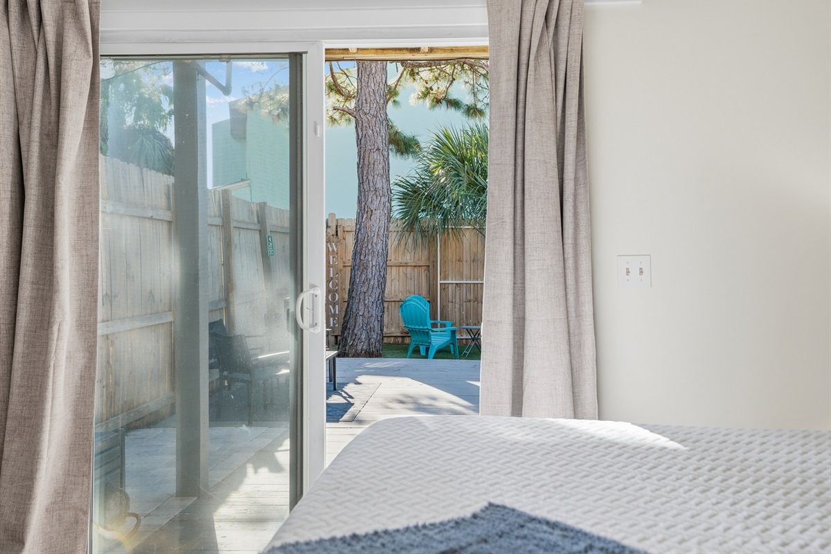 Bedroom # 2 is Downstairs with King Bed and Access to Backyard