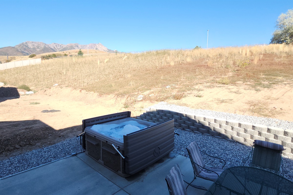 Soak in the private hot tub while taking in the stunning Wasatch Mountain views.