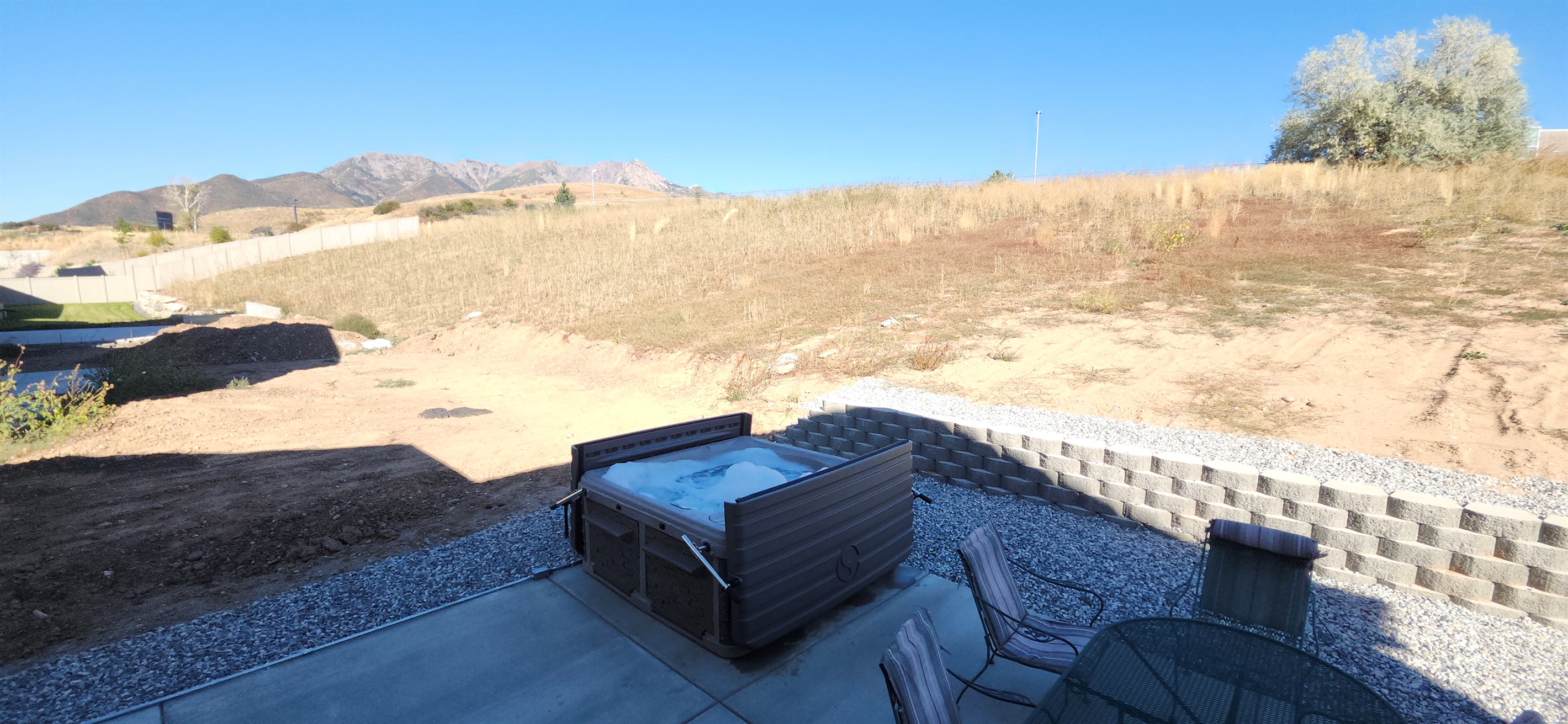 Soak in the private hot tub while taking in the stunning Wasatch Mountain views.