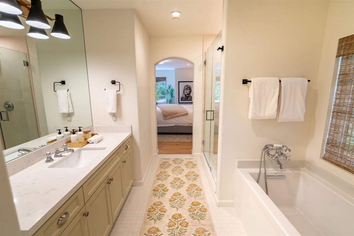 Primary bathroom with shower and bathtub