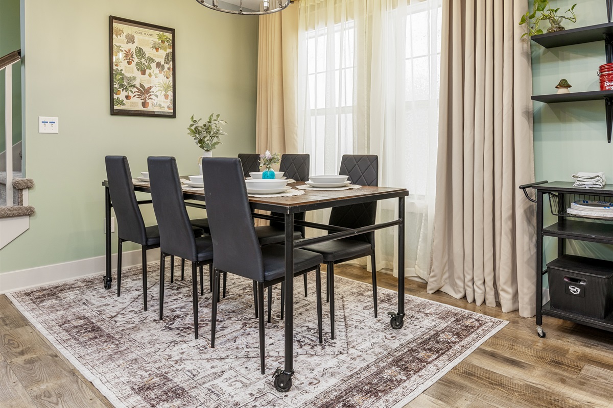 Dining area with seating for six provides plenty of room for group meals and gatherings. The open layout keeps everyone connected to the heart of the home.