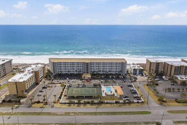 Surf Dweller complex is gulf front and has pool, fitness center and tennis courts
