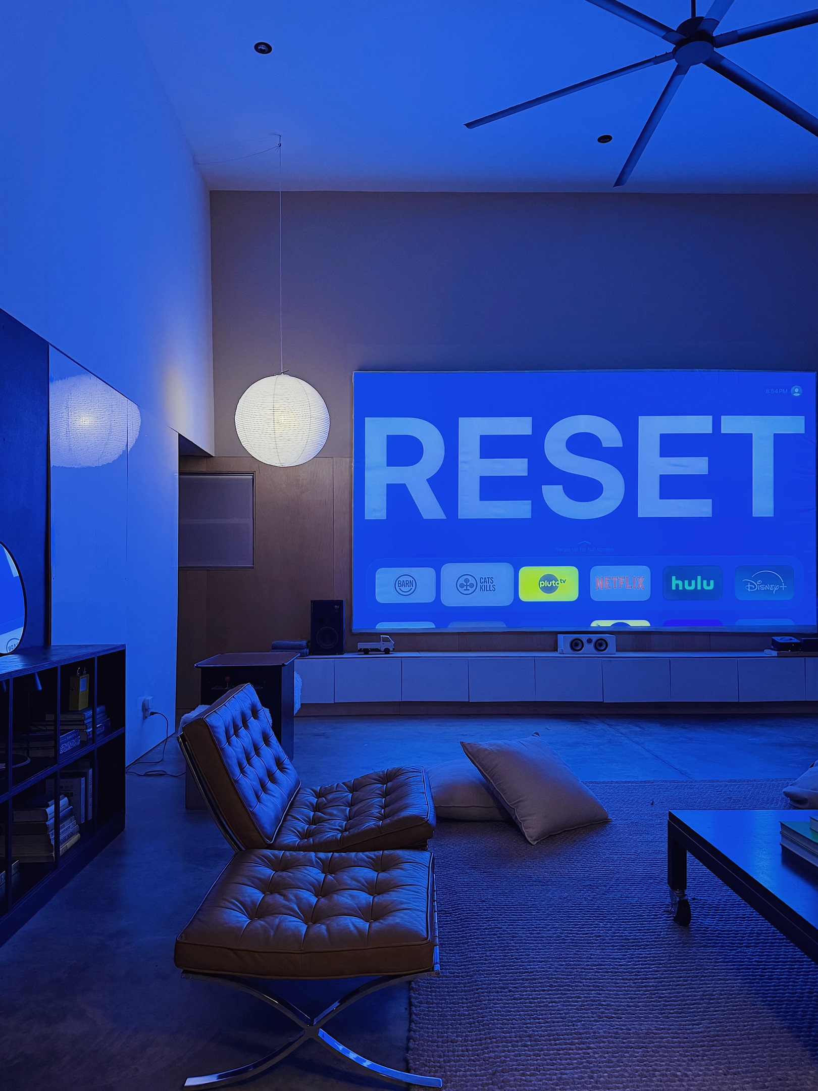 18' diagonal projector screen with AppleTV. Bring your own logins. Device is reset between every guest.