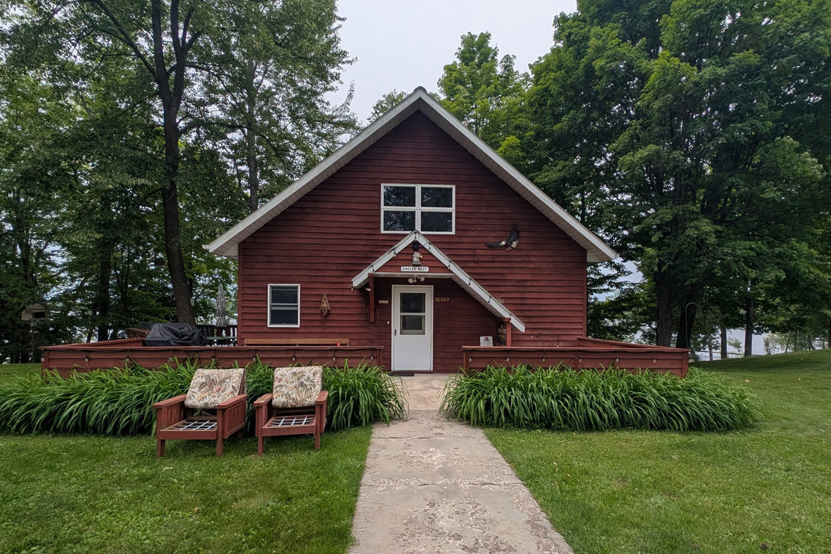 Eagle's Nest #4 Welcome to Eagle's Nest, a cozy A-Frame home with west-facing views that look over Butternut Lake. This beautiful cabin features wall-to-wall picture windows that fill every room with natural light and sweeping lake vistas.