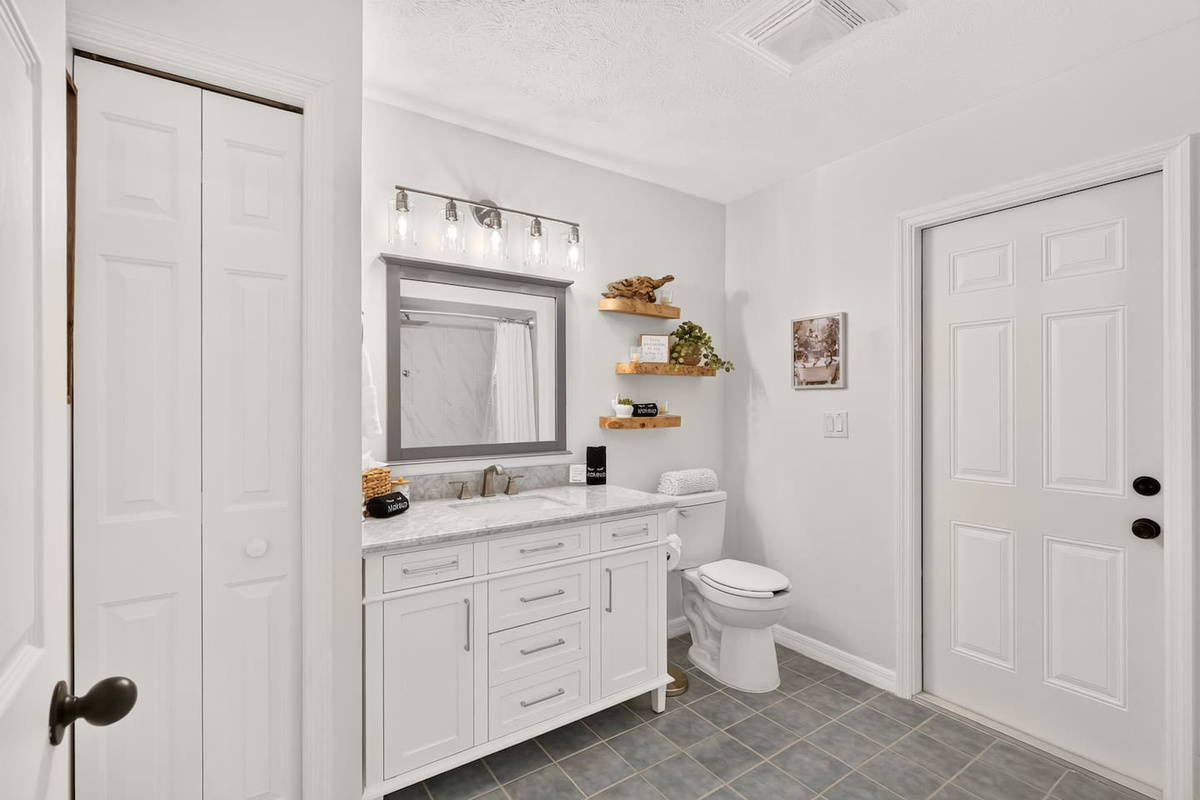 Bathroom #3 is located by bedroom #4.  This bathroom is spacious and features a shower/tub combo and a linen closet.