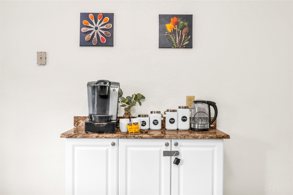 Bright, spacious kitchen featuring full-size stainless appliances, a dedicated coffee bar, and a bonus dining area with seating for four—perfect for families and groups.