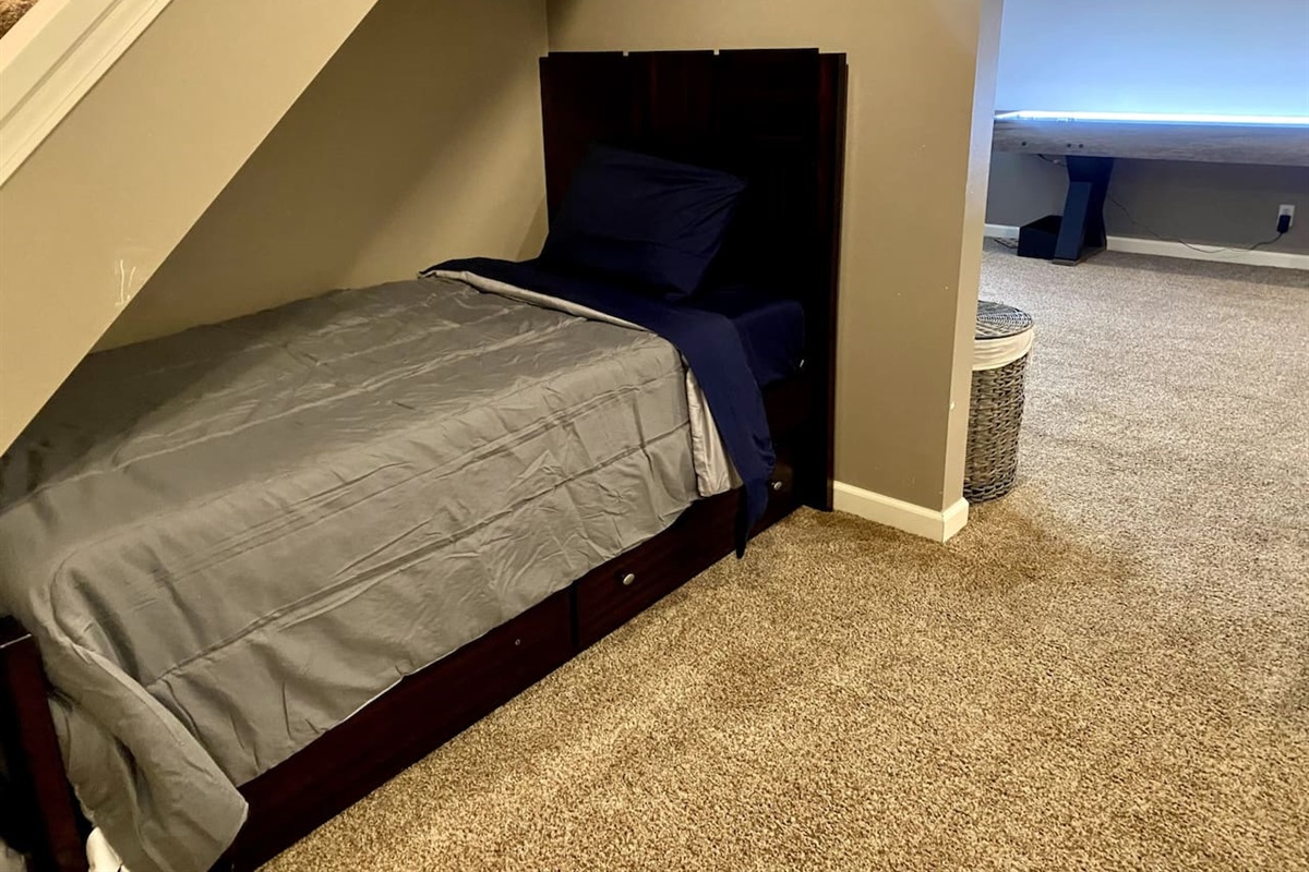 Turning under-stair space into sweet dreams—twin beds with a hidden trundle for ultimate comfort 