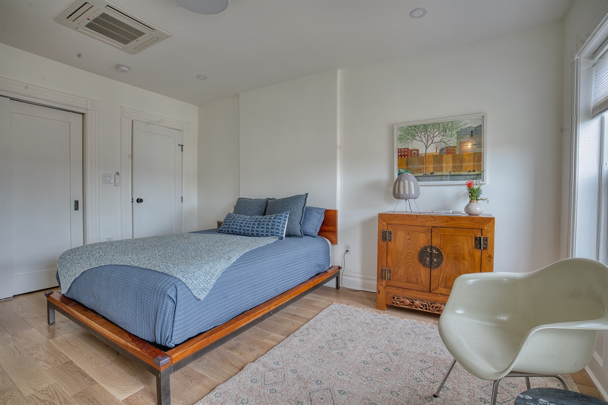 Queen sized bed on the upper floor of duplex complete with en-suite bathroom with heating floors for additional comfort. 