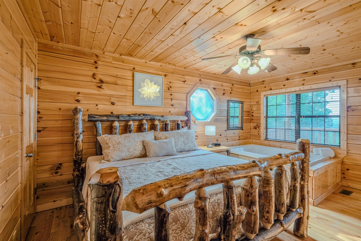 Master bedroom with traditional log king bed to give you authentic mountain cabin feel.