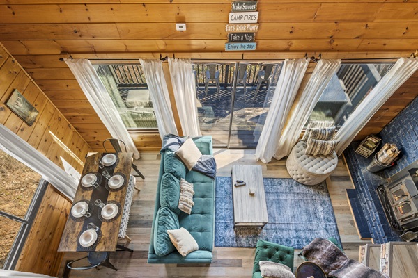 Birds eye view from king loft bedroom lookout on all the main living room floor action.