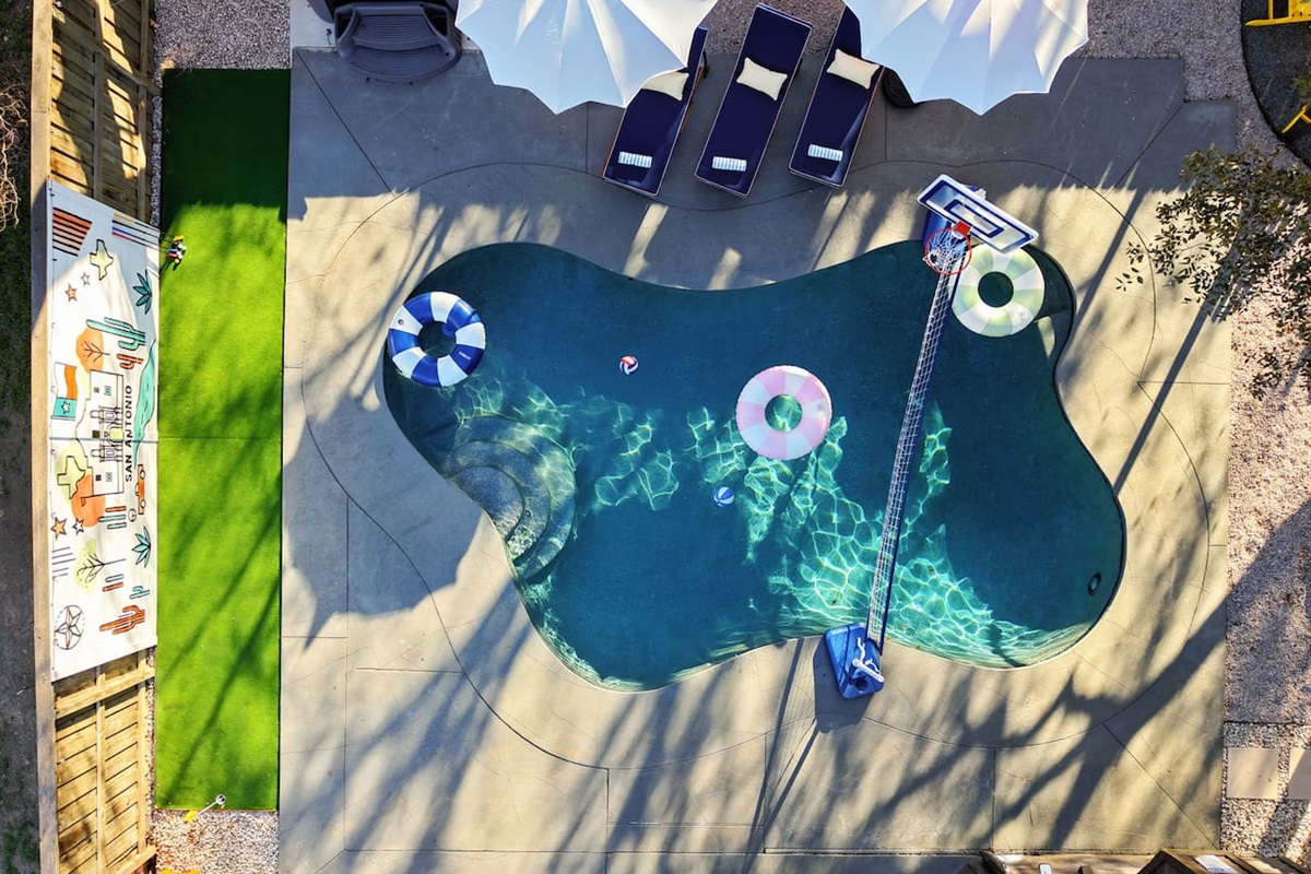 Aerial view perfection ⛱️  
Dive into fun with a private pool, poolside basketball & volleyball, and your own putting green right next door!