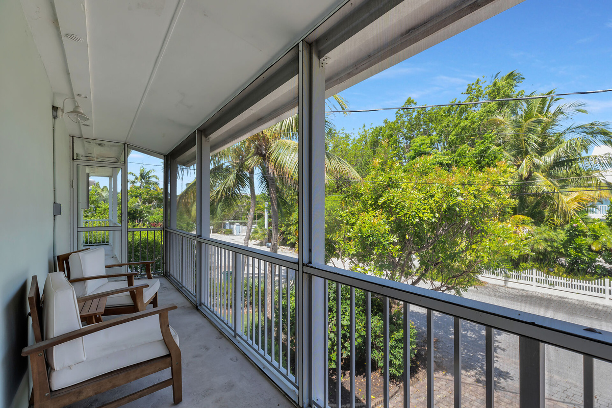 Private screened patio off primary bedroom
