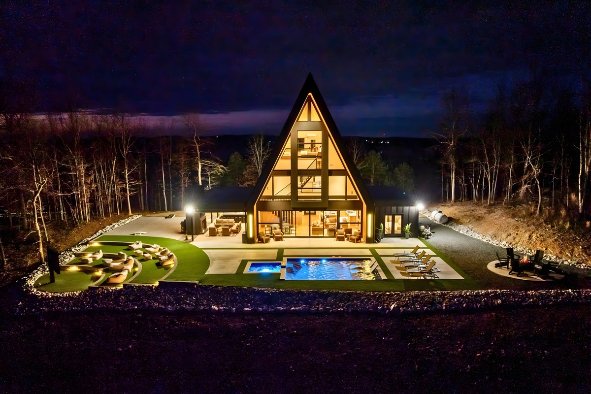 The nighttime view is such a showstopper, with the pool and outdoor spaces glowing and creating a